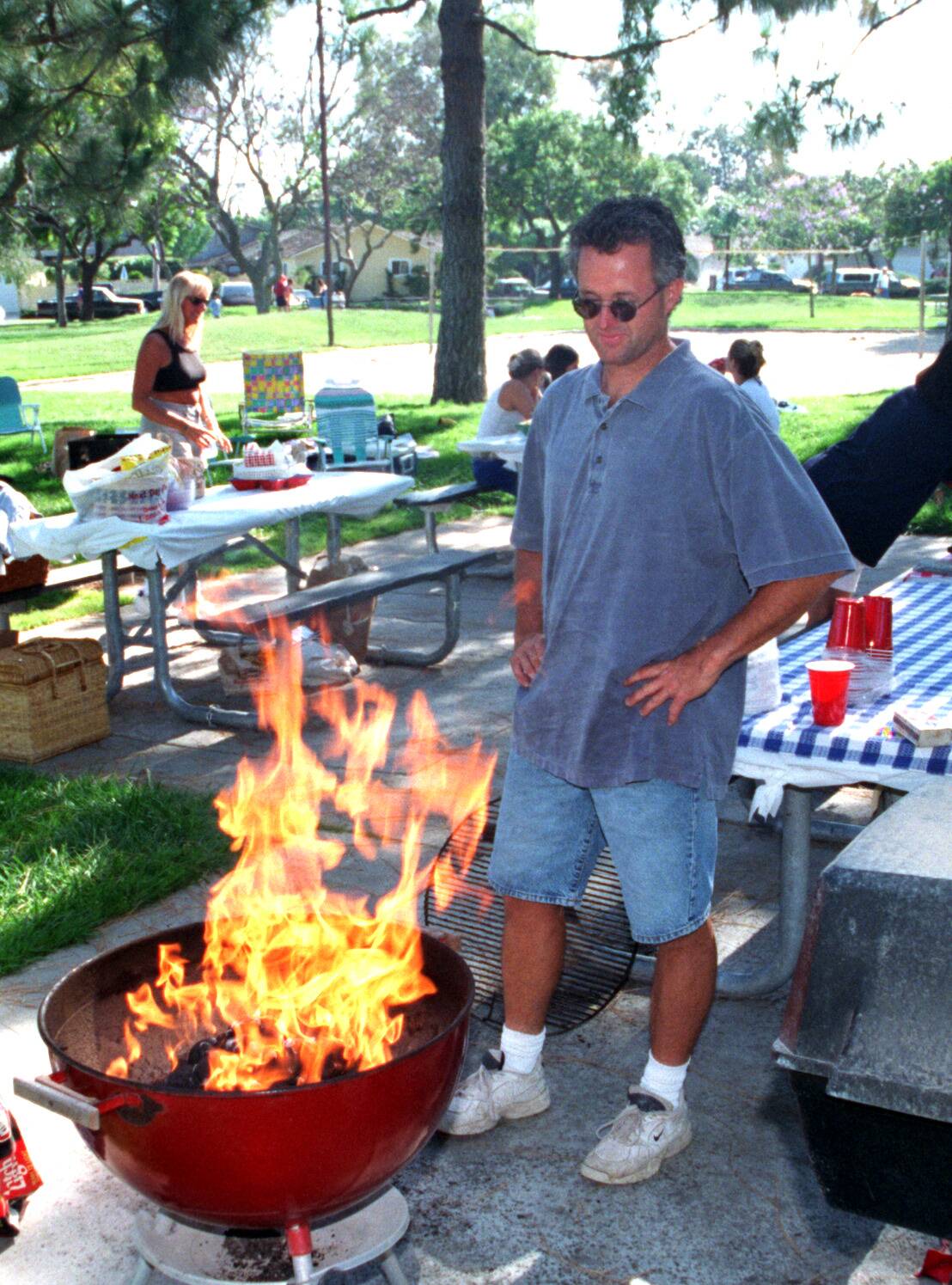 ME.Rossmoor.cookout.3.BG.26May97Brent Peterson fires up the barbecue at Rossmoor Park on Memorial